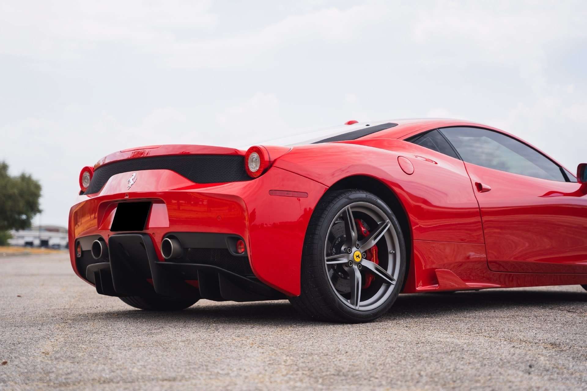 Rear view of the 2014 Ferrari 458 Speciale with gray 20-inch wheels