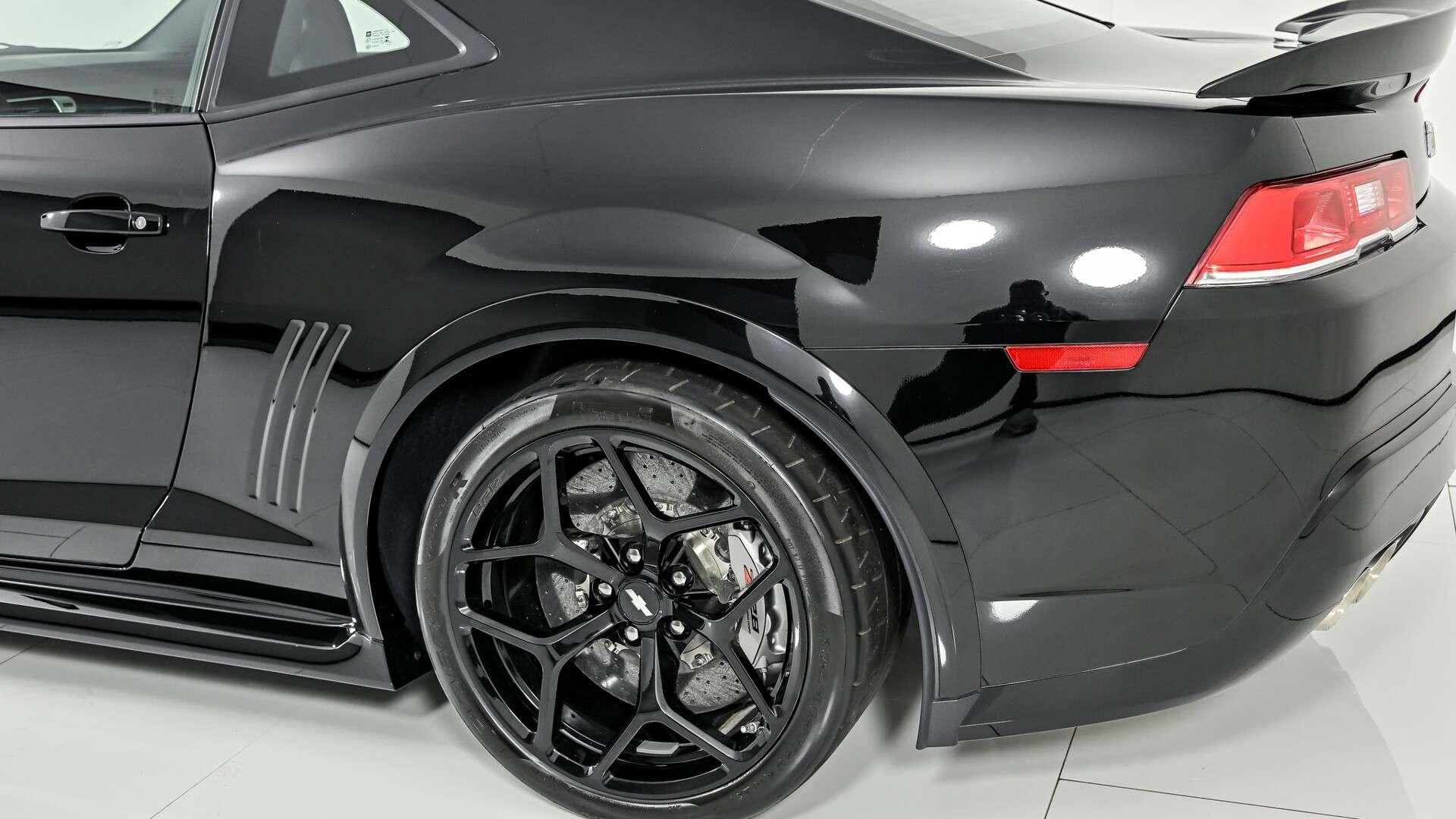 2015 Chevrolet Camaro Z/28 in black with 663 miles, rear three-quarter view