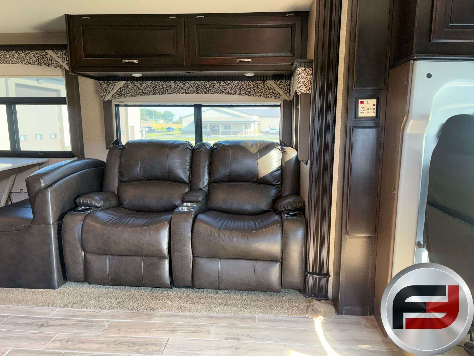 Leather theater seating in the 2017 Dynamax DX3 37TS living area