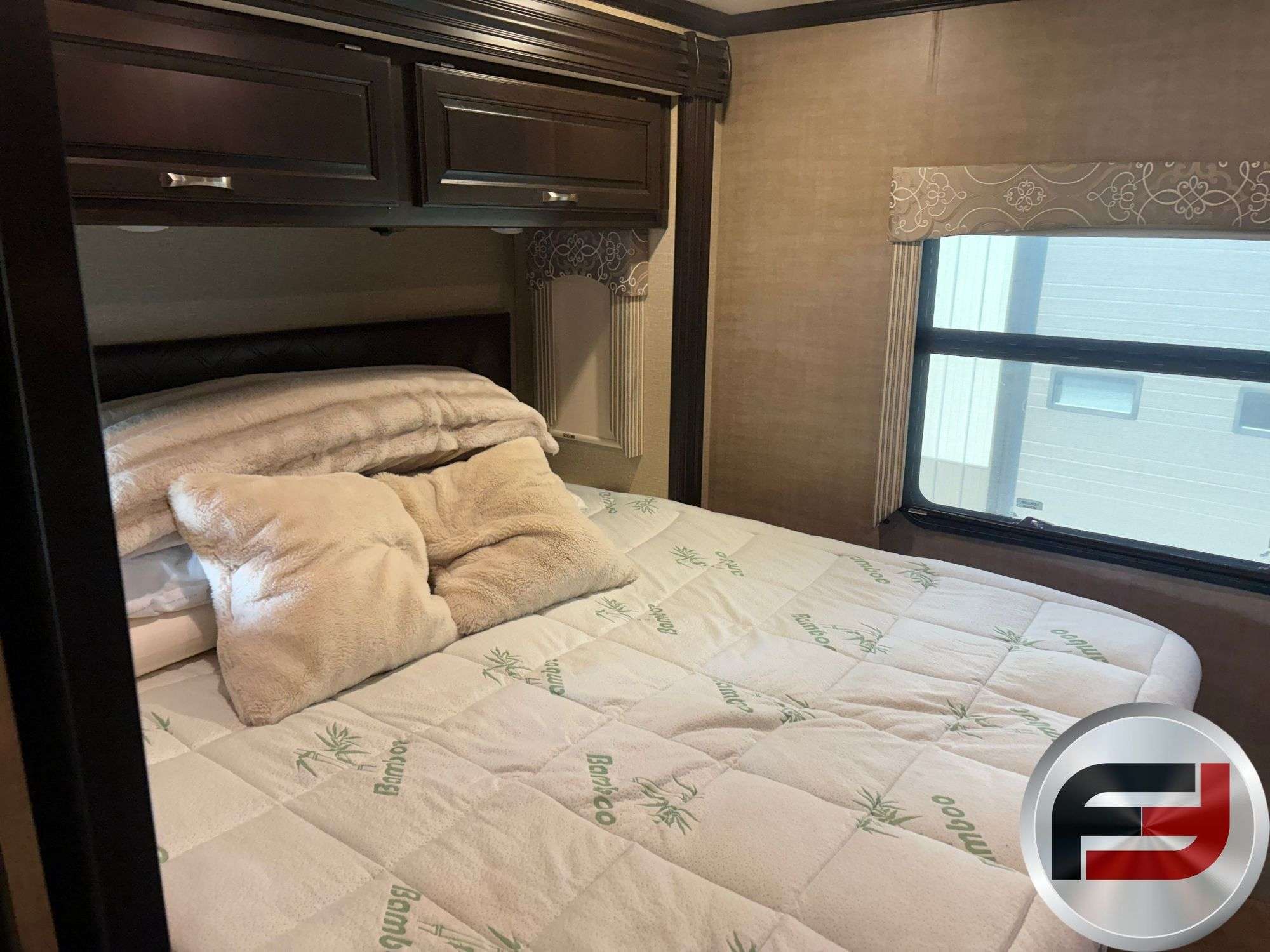 Bedroom with king mattress in the 2017 Dynamax DX3 37TS