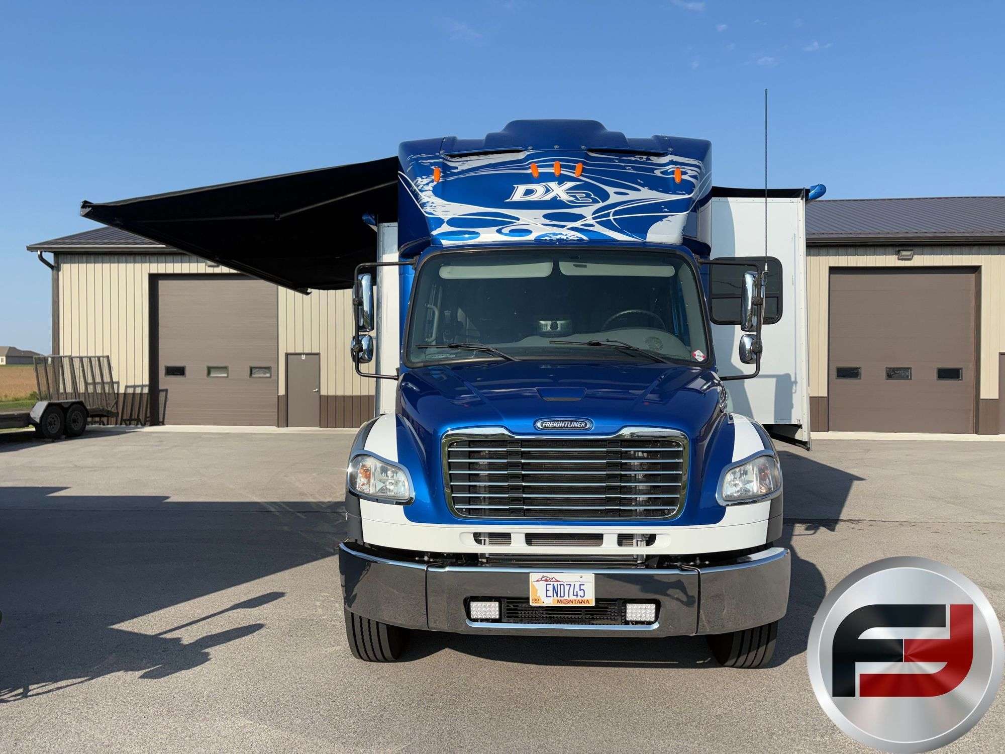 Front view of the 2017 Dynamax DX3 37TS with power patio awning extended