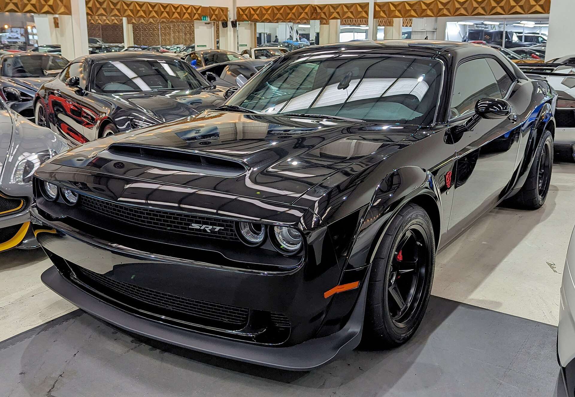 Black 2018 Dodge Challenger SRT Demon parked on a dealership lot, front three-quarter view
