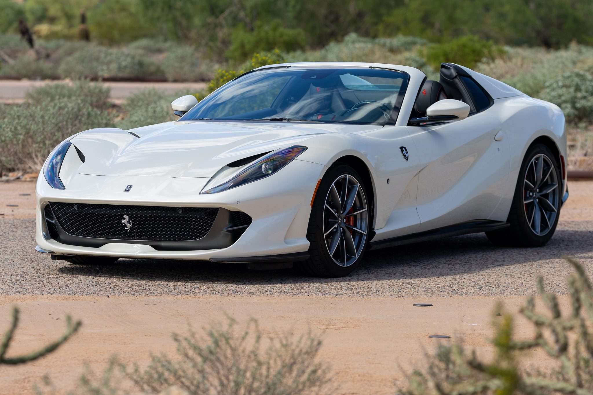 Front three-quarter of the white 2021 Ferrari 812 GTS with its hardtop retracted
