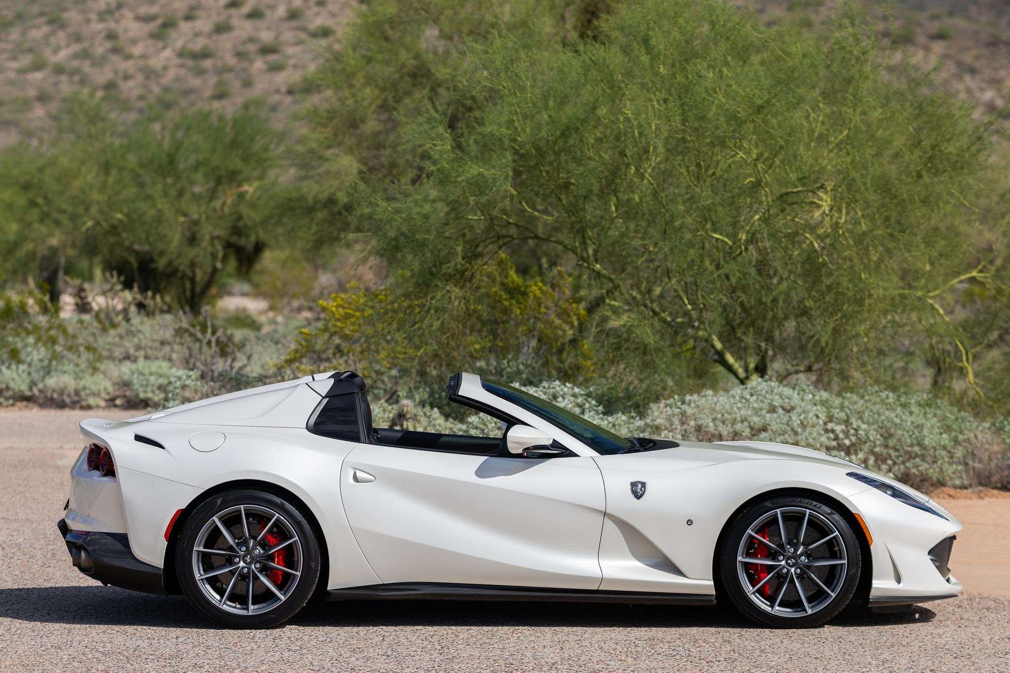 Side profile of the Bianco Italia 2021 Ferrari 812 GTS in the Arizona desert