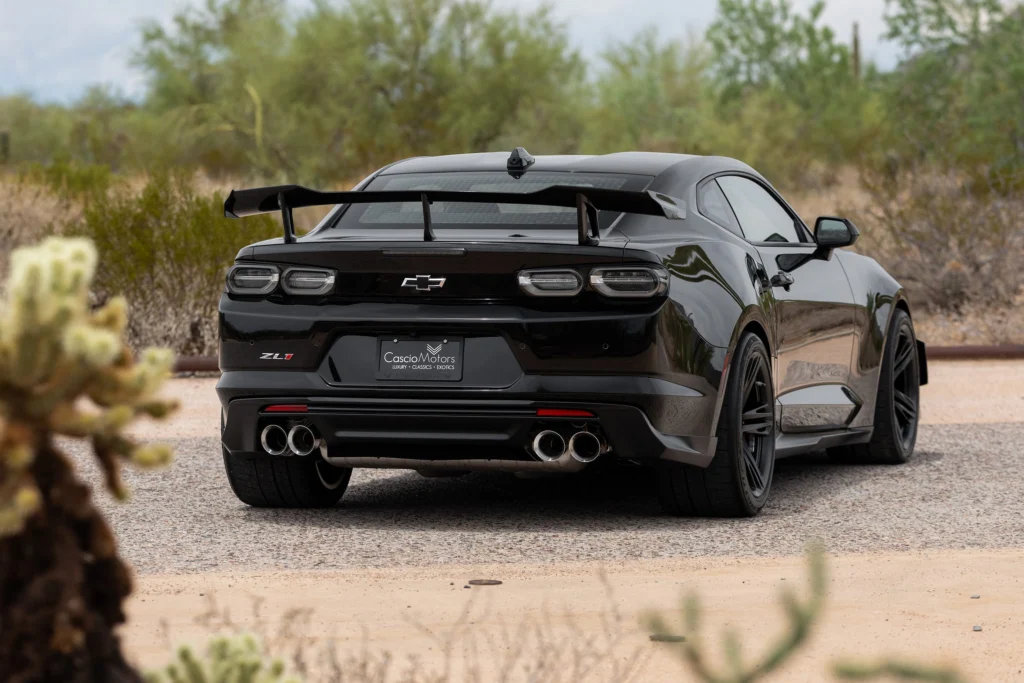 Rear view of a black 2023 Camaro ZL1 1LE with quad exhaust tips