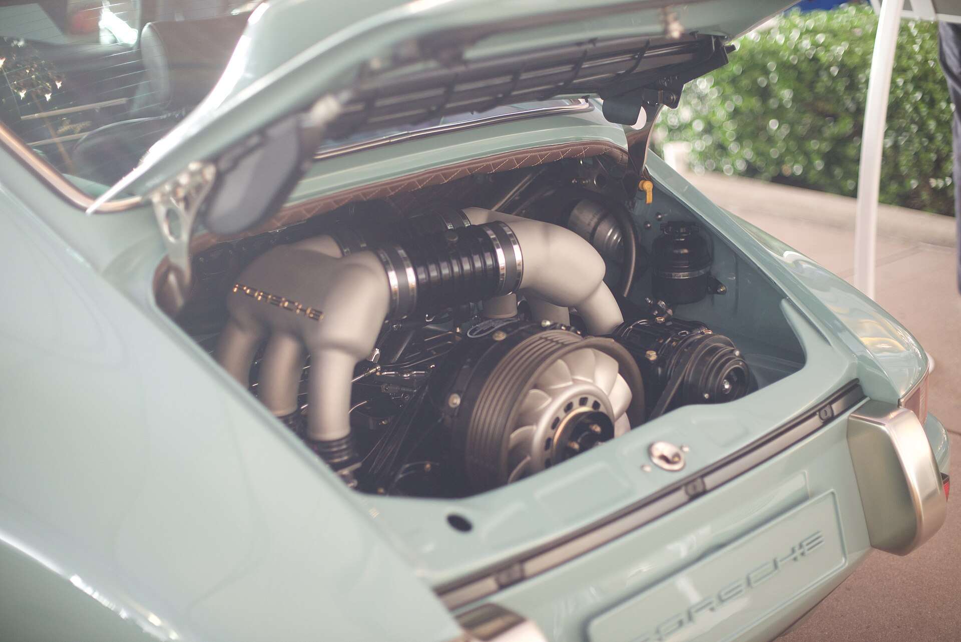 Air-cooled naturally aspirated flat-six engine from a Porsche 911 resting in a padded case