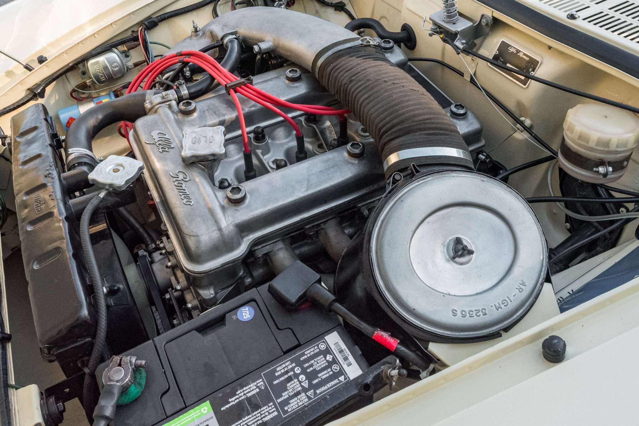 1,570cc twin-cam four-cylinder engine with Alfa Romeo cam cover and round air cleaner in a 1966 Alfa Romeo 1600 Spider