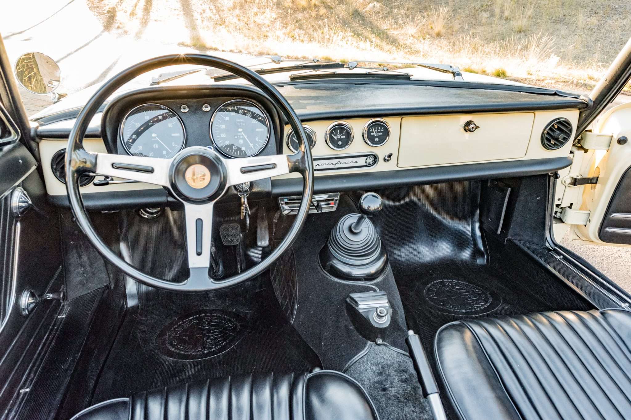 Black Skai vinyl interior and painted dashboard of a 1966 Alfa Romeo 1600 Spider