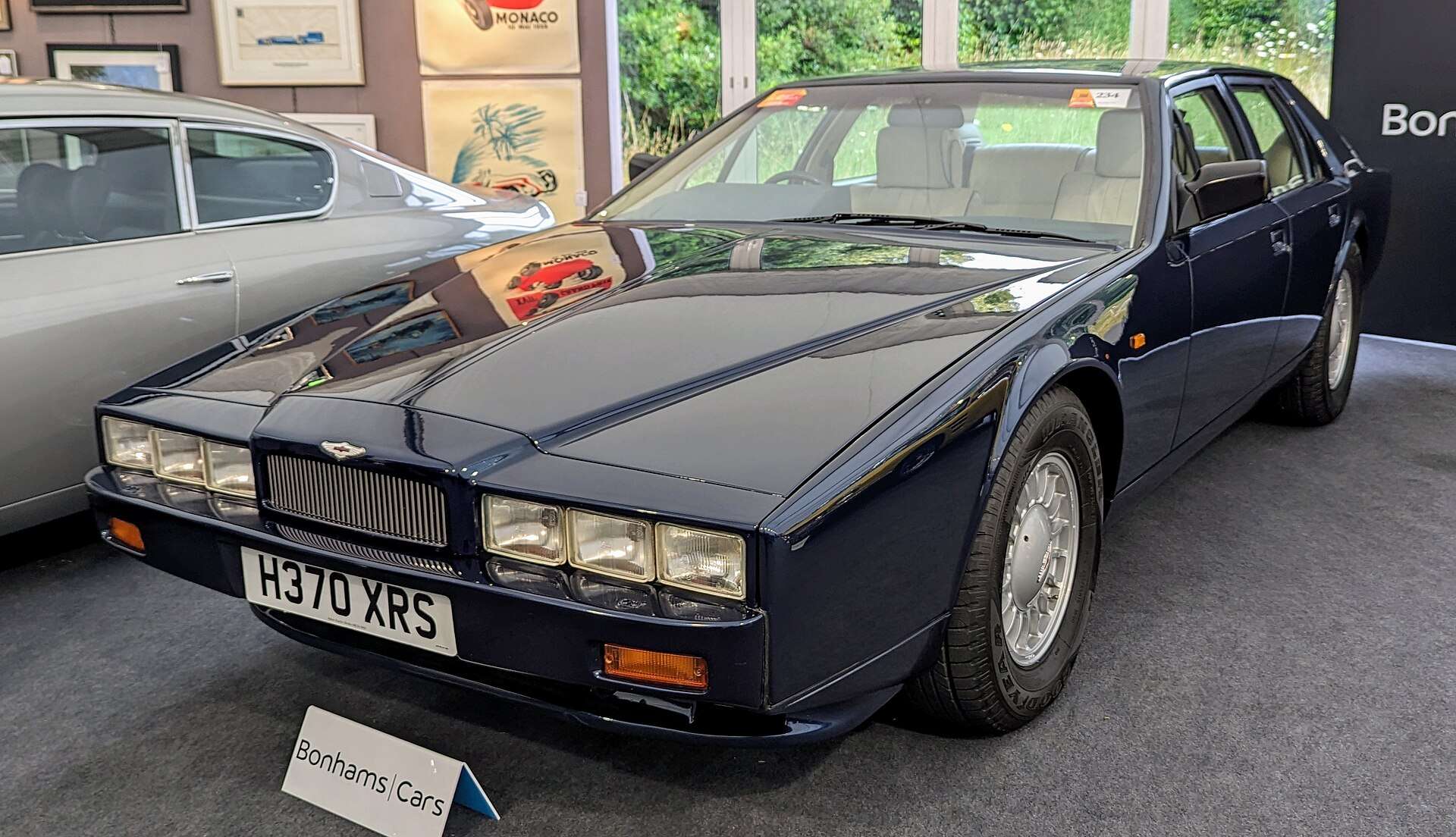 Dark blue 1990 Aston Martin Lagonda Series 4 parked indoors, seen from the front left