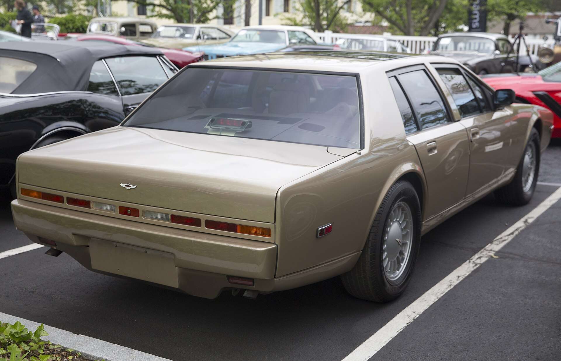 Rear three-quarter view of a 1988 Aston Martin Lagonda Series 4 showing the waterfall trunk lid and narrow taillight strip