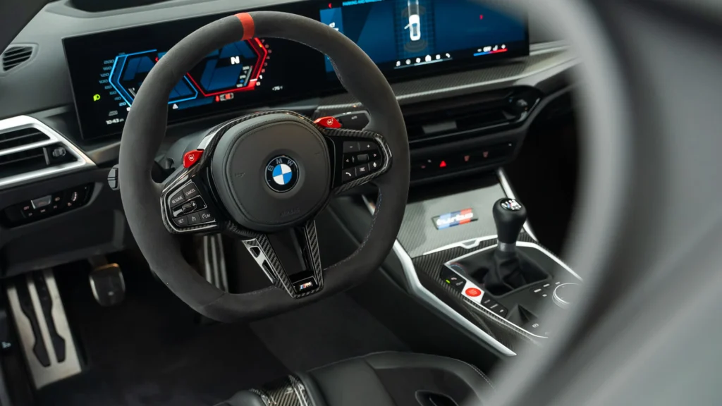 BMW M2 Turbo Design Edition interior with six-speed manual shifter and BMW Curved Display