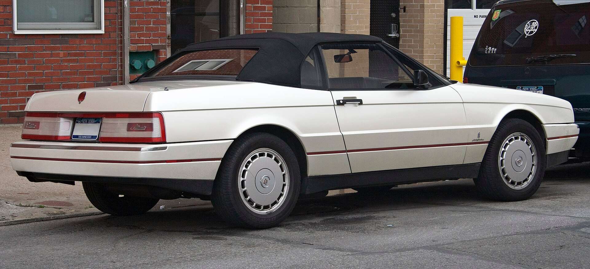 Rear view of a pearl-white 1991 Cadillac Allanté showing the Pininfarina-styled tail
