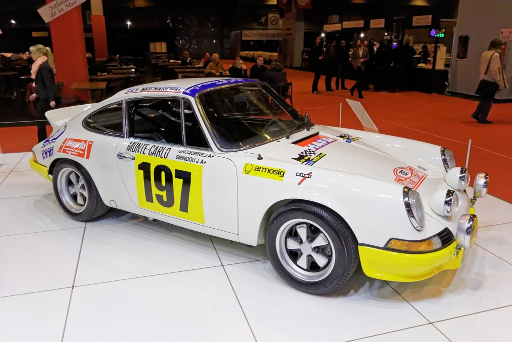 White 1973 Porsche 911 Carrera RS 2.7 in Monte Carlo rally livery, race number 197, at Retromobile 2015