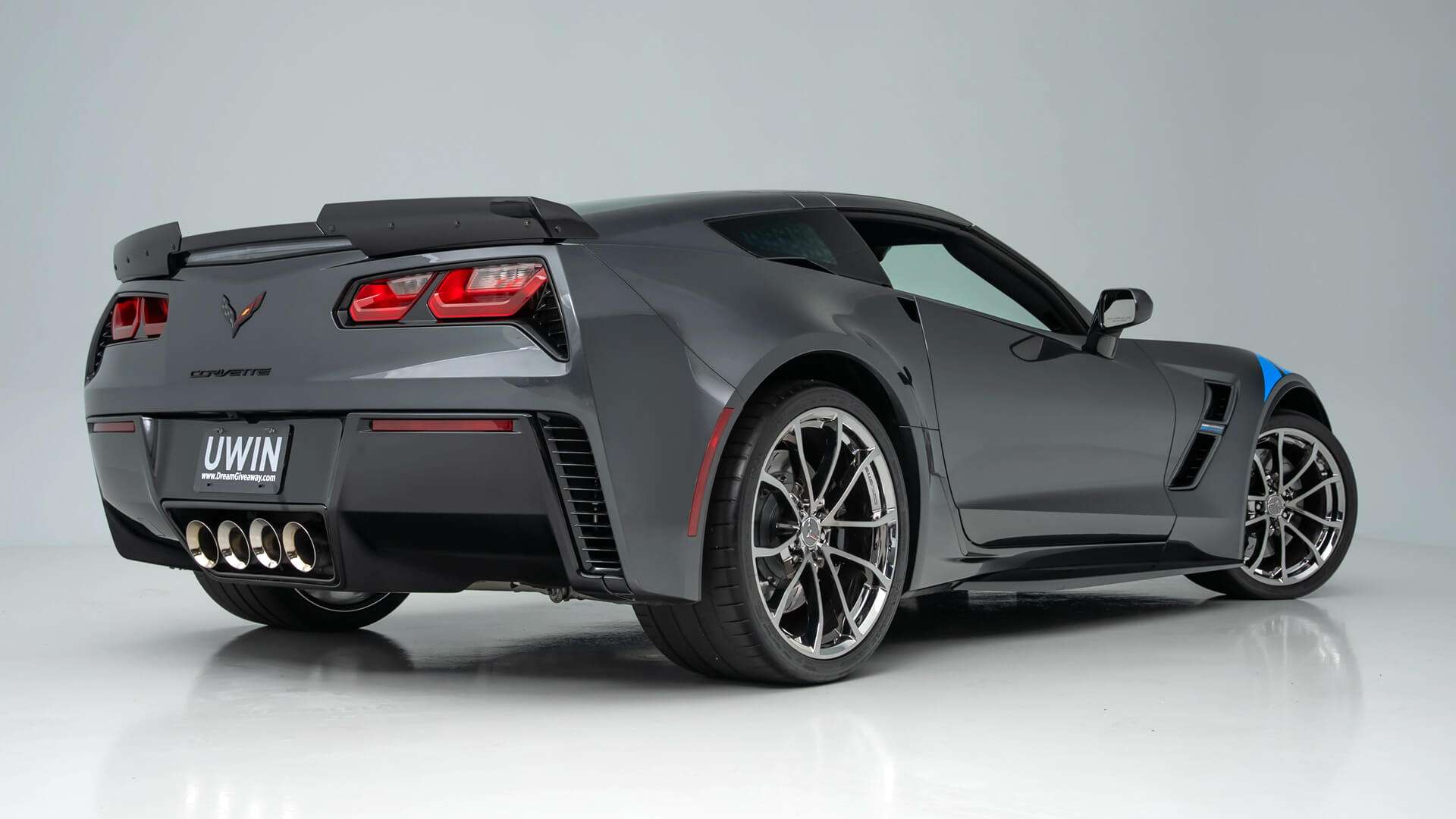 Rear three-quarter view of the 2017 Corvette Grand Sport Collector Edition showing quad exhaust and black Cup-style wheels