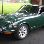 On a 1970 Datsun 240Z, the Number Plates and Hatch Vents Decide Whether It’s a Real Series I Dark green Datsun 240Z Series I parked on grass