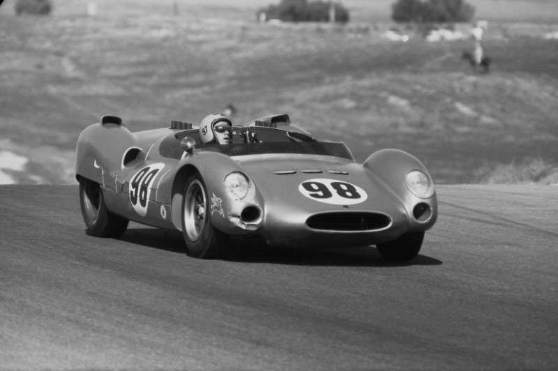 Black-and-white photo of Dave MacDonald in helmet at the wheel of the number 98 Shelby King Cobra after winning the 1963 Los Angeles Times Grand Prix