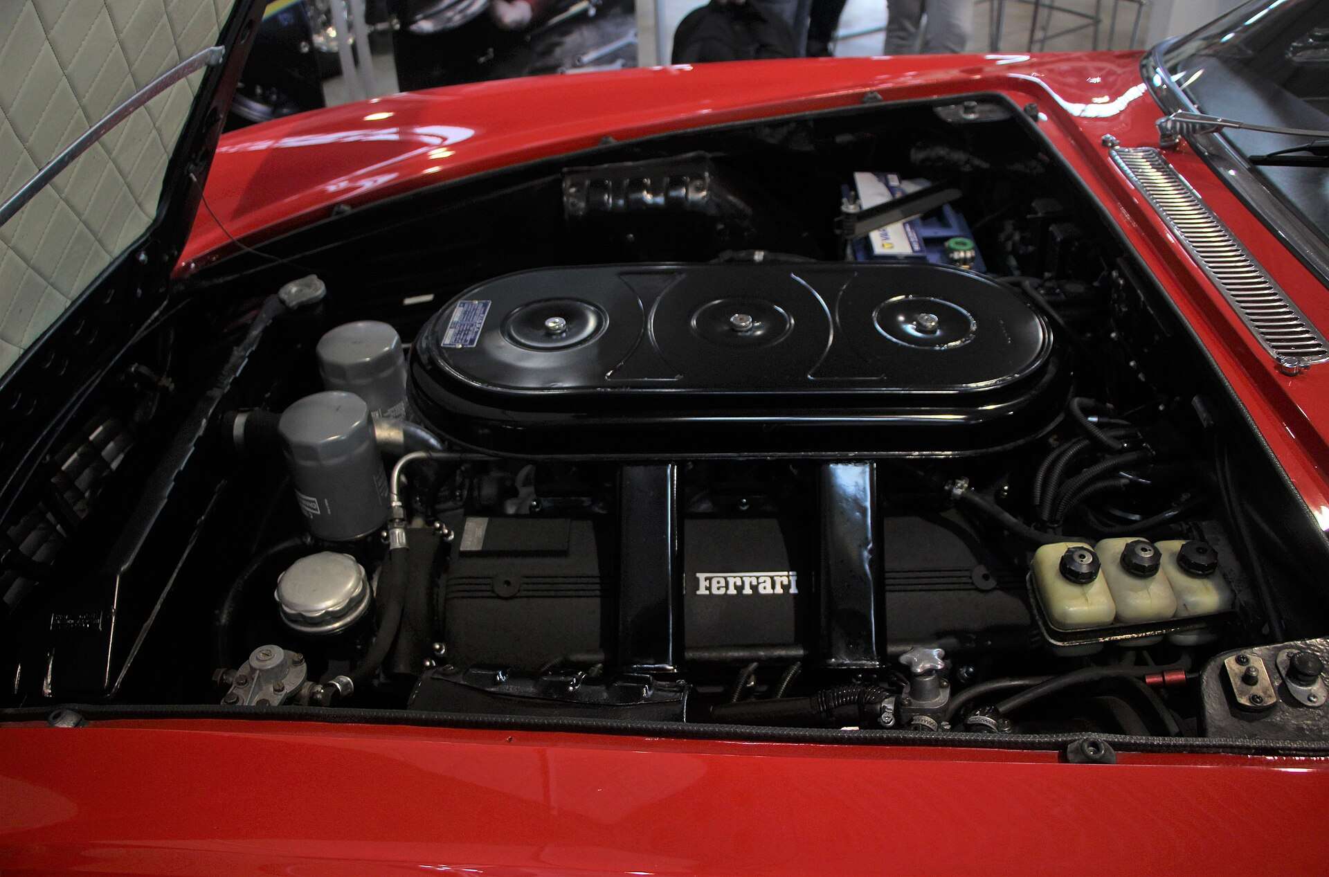 Engine compartment of a Ferrari 330 GT 2+2 showing the Colombo V12 and its carburetors
