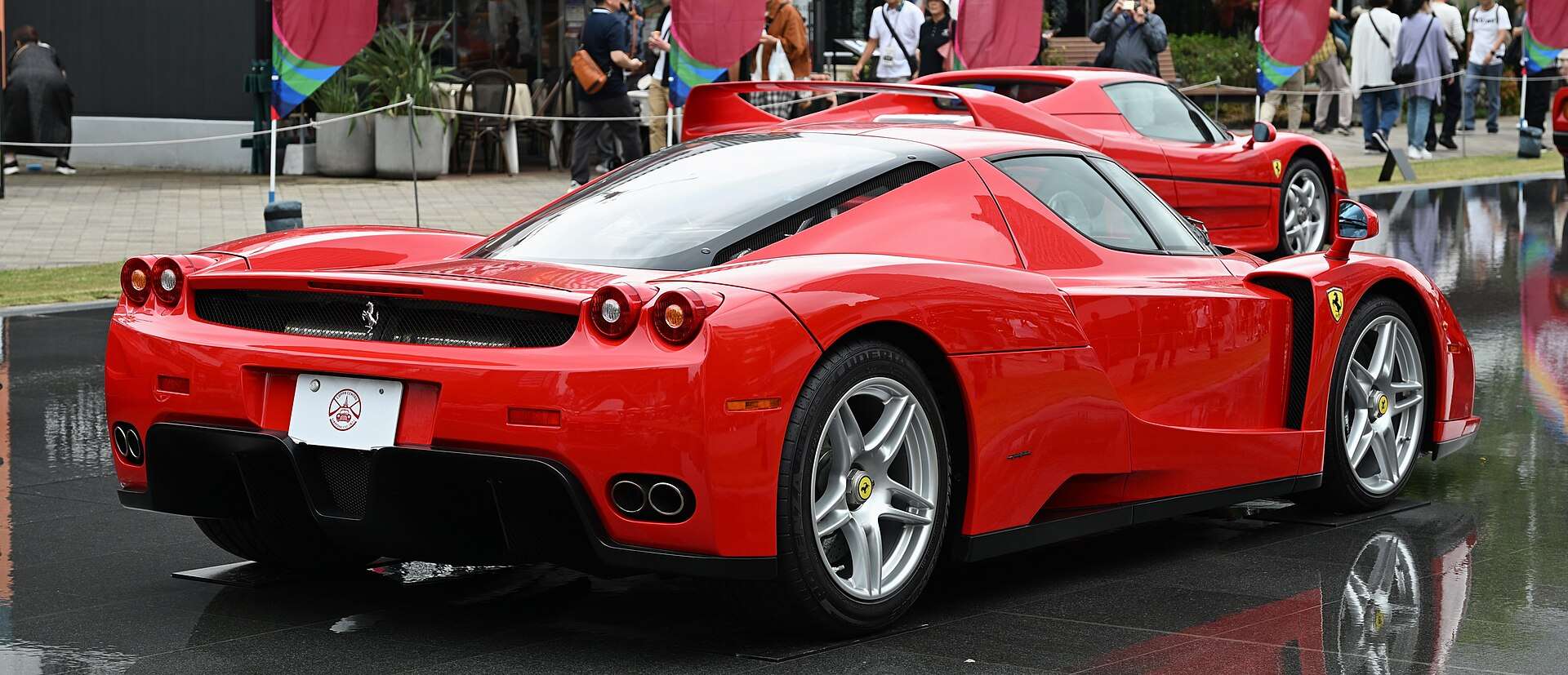 Rear three-quarter view of a Ferrari Enzo showing the carbon bodywork and exhaust