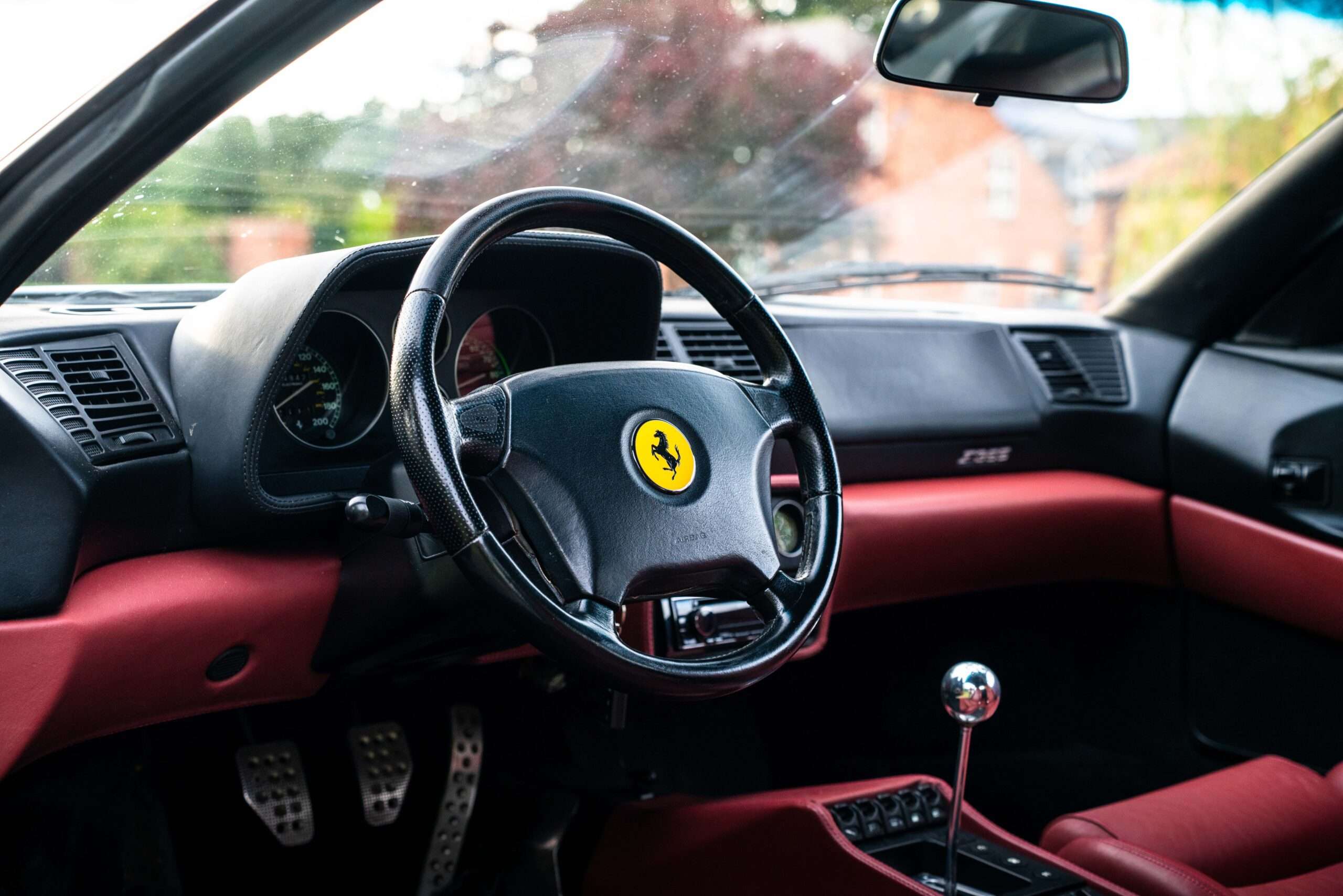 White 1995 Ferrari F355 Berlinetta from the rear three-quarter