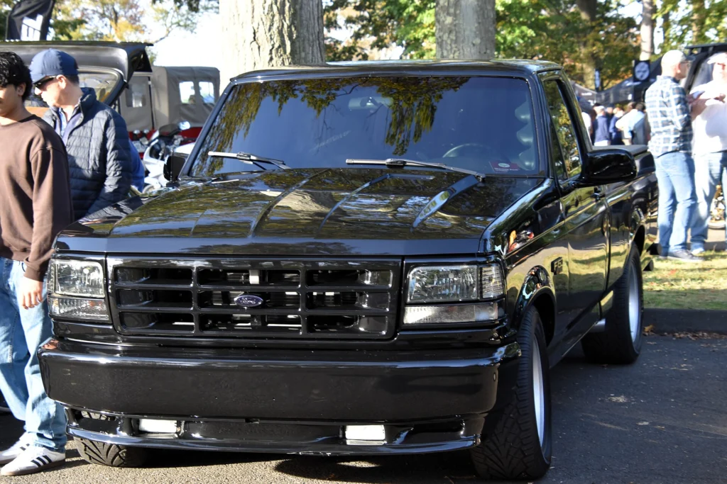 Black 1994 Ford F-150 SVT Lightning sport truck seen from the front with a lowered stance and 17-inch wheels
