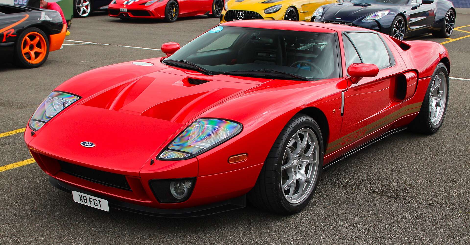 Red 2005 Ford GT front three-quarter view showing the mid-engine supercar's proportions