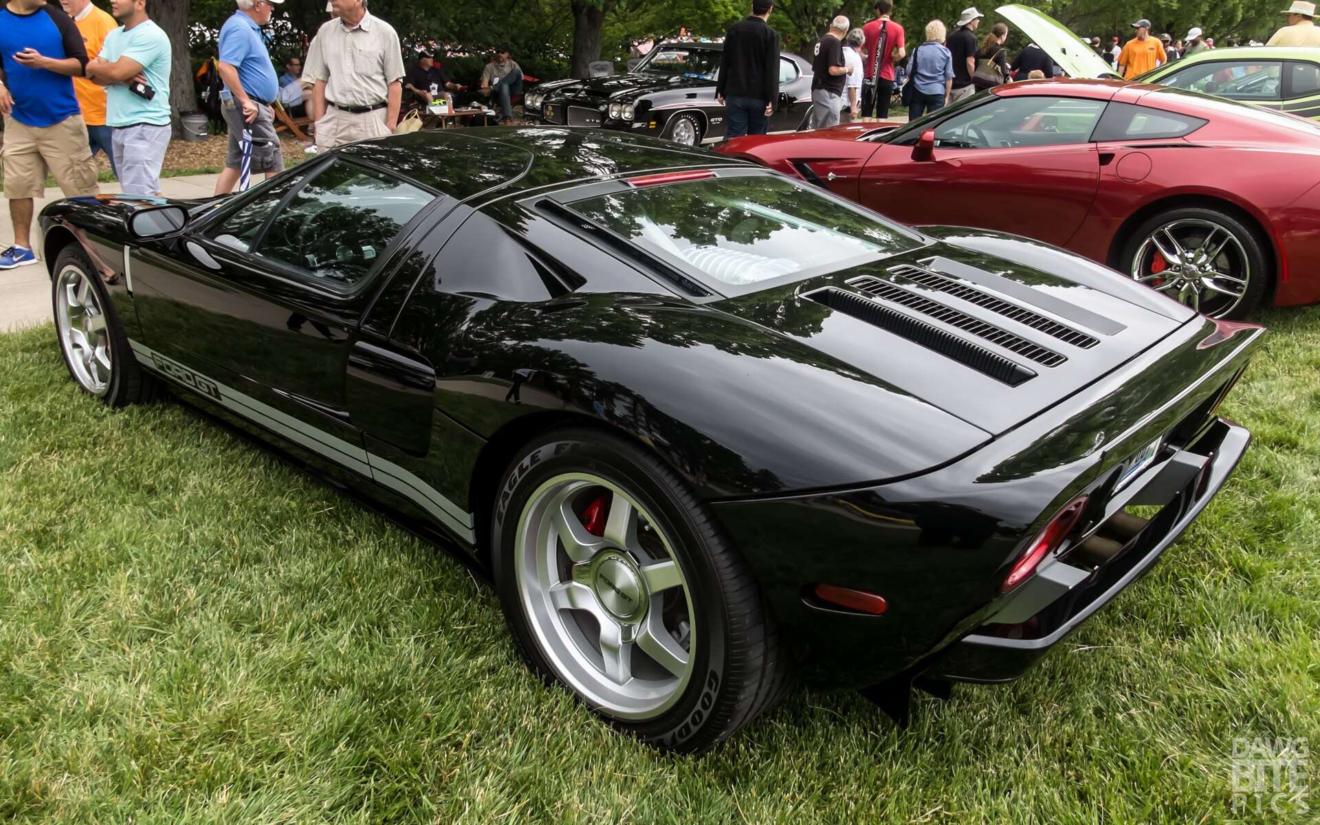 Black first-generation Ford GT in rear three-quarter view showing the aluminum bodywork and rear diffuser