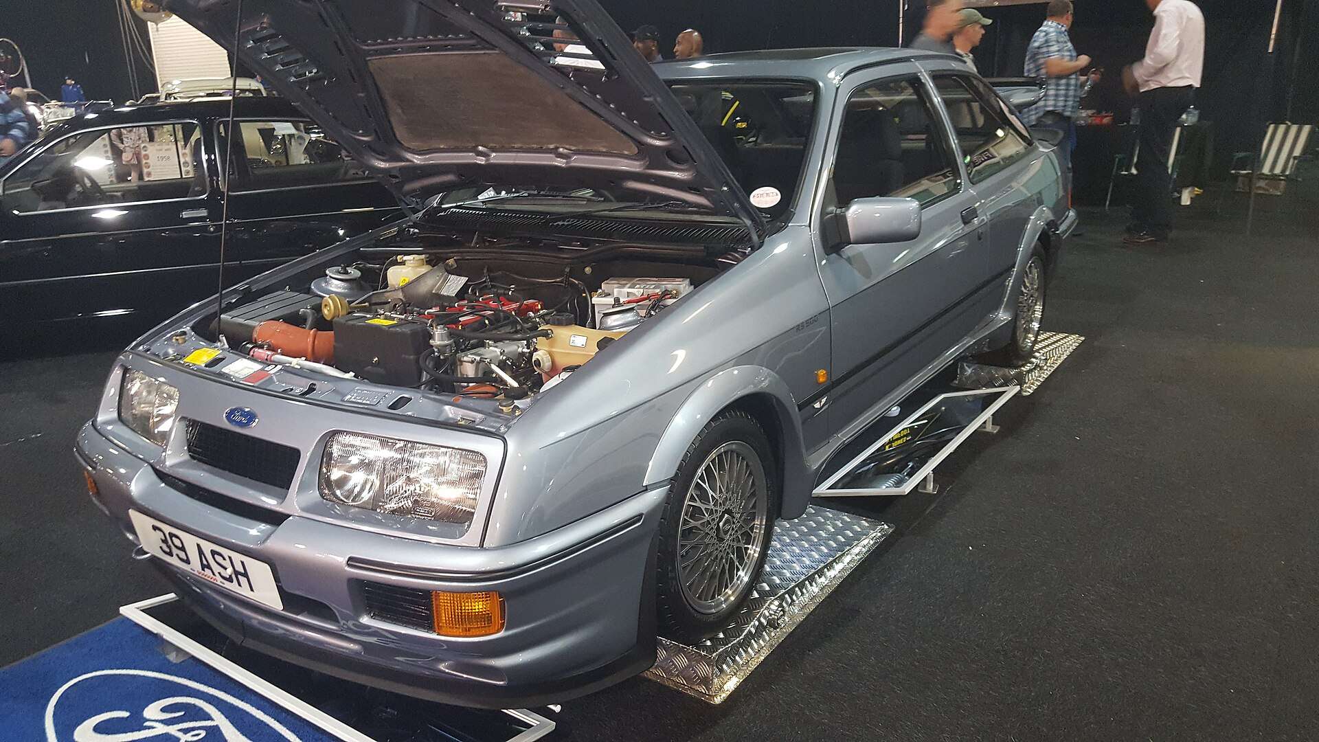 1987 Ford Sierra RS500 Cosworth on display with its bonnet raised to show the turbocharged engine