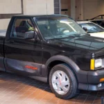 Syclone vs Lightning vs 454 SS: Three '90s Super Trucks, Three Kinds of Collectible Black 1991 GMC Syclone compact pickup shown front three-quarter on a museum floor