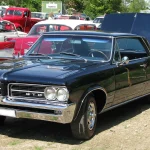 On a 1964–65 Pontiac GTO, the VIN Cannot Prove It Is a GTO. The PHS Paperwork Can. A 1964 Pontiac GTO in front three-quarter view