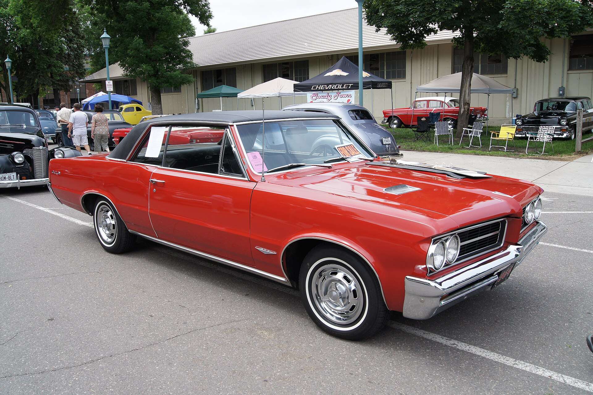 A 1964 Pontiac GTO shown at a car show