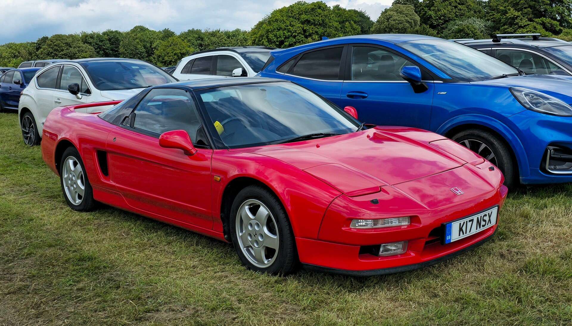 Red 1993 Honda NSX with pop-up headlights, the original car behind the JAS Tensei