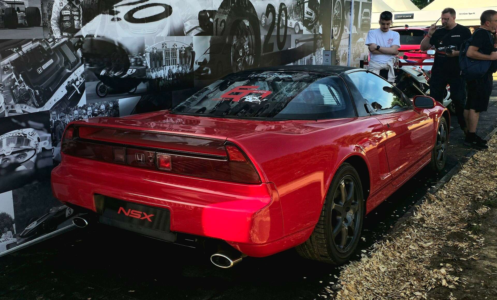Rear three-quarter view of a first-generation Honda NSX with NSX badge and twin exhaust