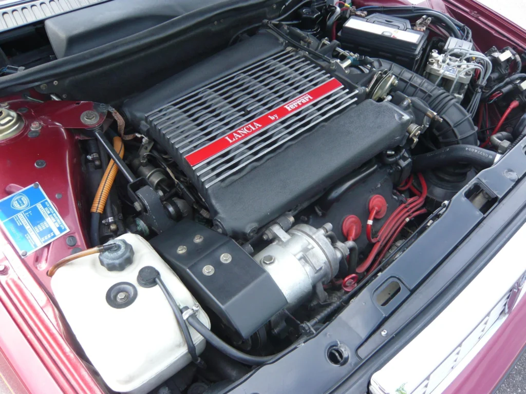 Ferrari-derived 2.9-litre V8 in a Lancia Thema 8.32 engine bay with red Lancia by Ferrari lettering on the cam cover