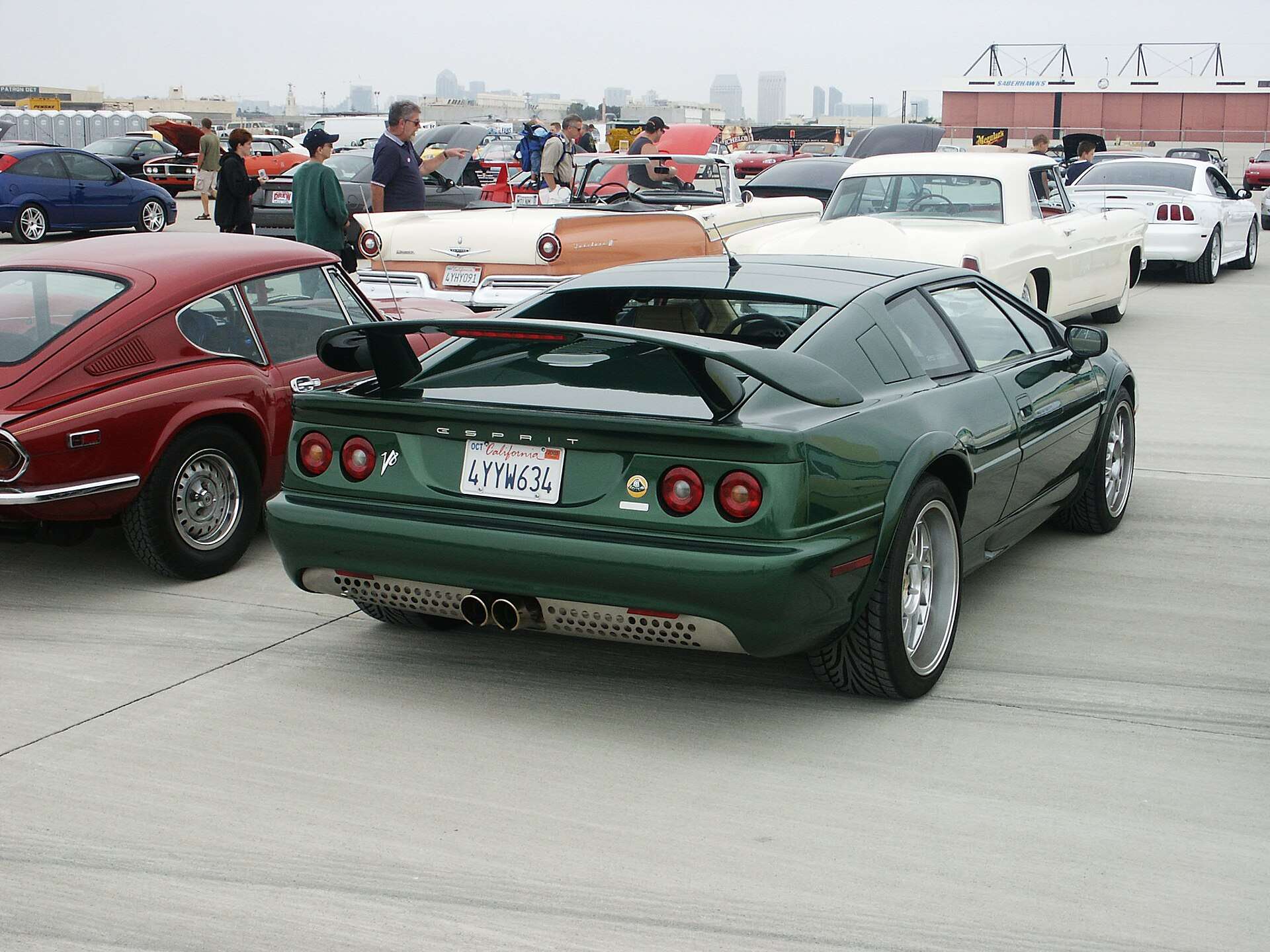 Rear view of a green 2001 US-version Lotus Esprit V8 parked at a car show
