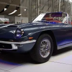 Lot of the Day: A 1964 Maserati Mistral Spyder 3500, One of 27, Is at $170,000 on BaT, and Its Accident History Will Set the Price Blue Maserati Mistral Spyder convertible with wire wheels displayed on a polished floor at an indoor Maserati anniversary show