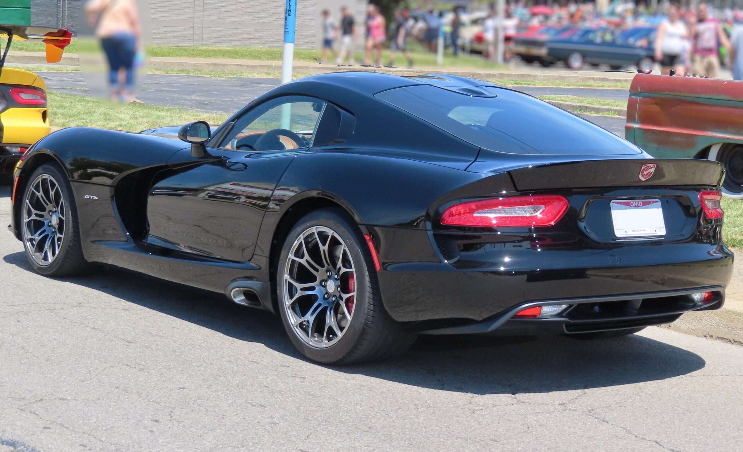 Rear three-quarter view of an SRT Viper GTS coupe showing the double-bubble roof and quad exhaust outlets