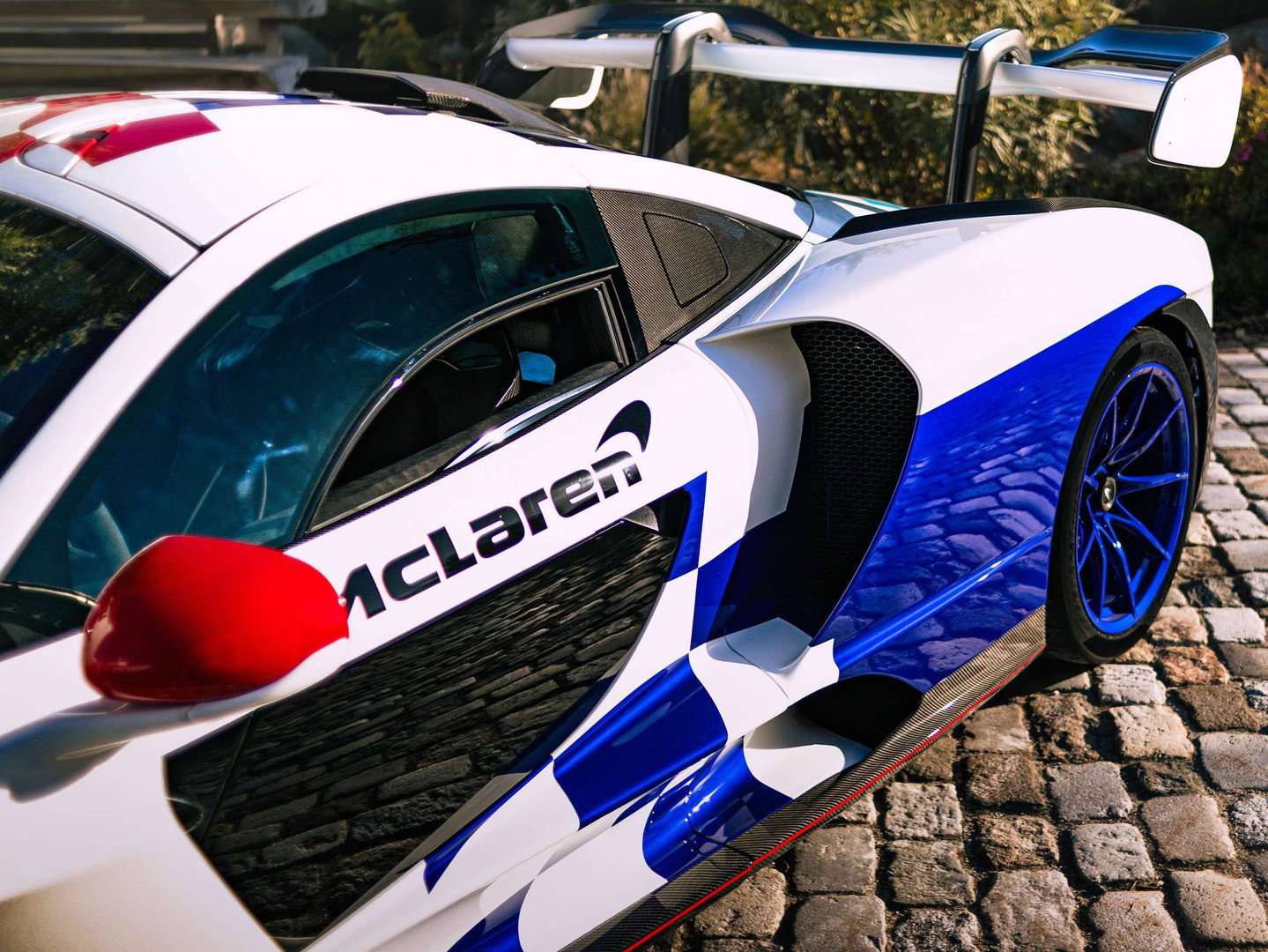 Side detail of McLaren Senna Fina livery with McLaren script and blue chequers