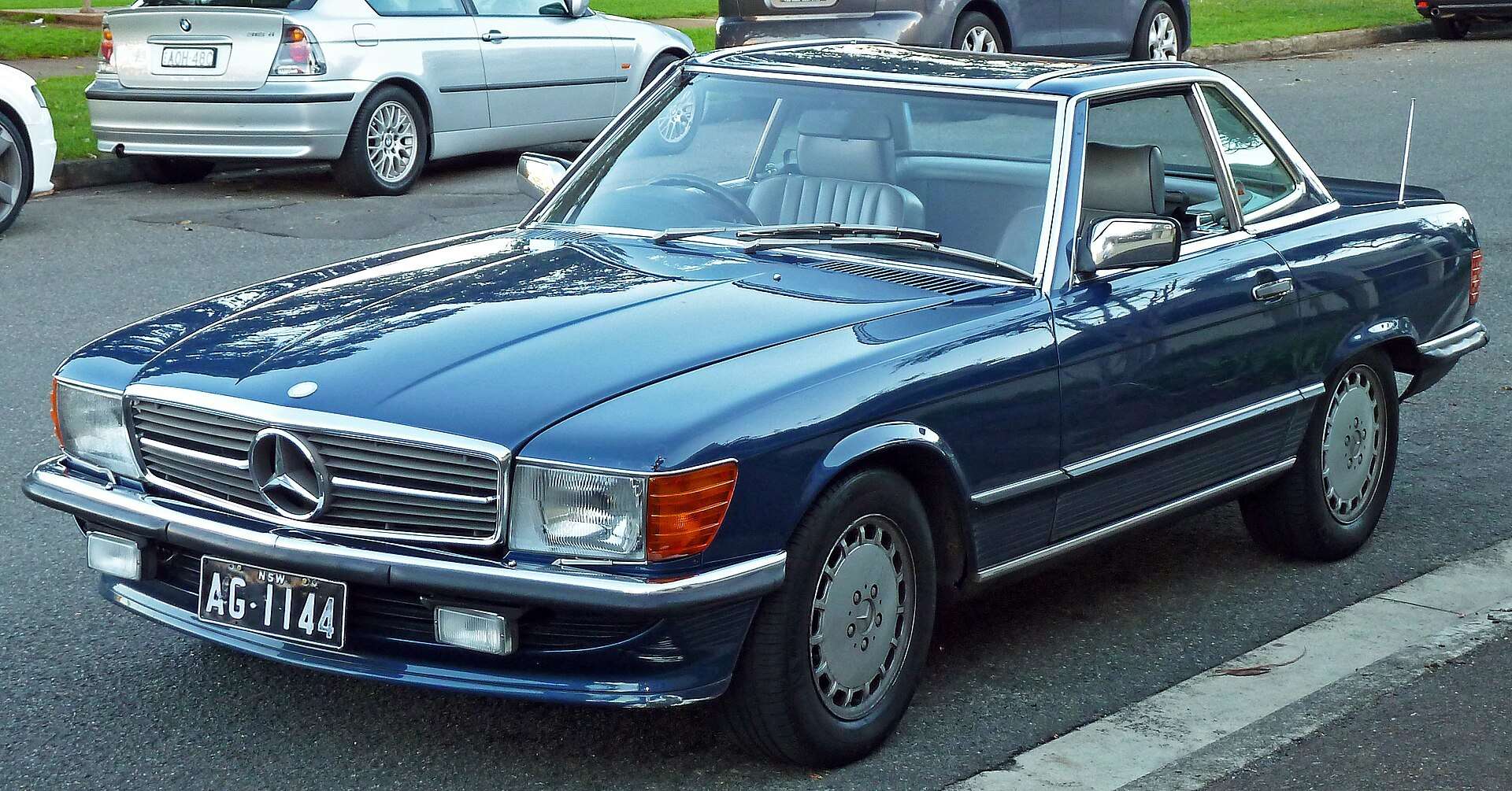 Blue 1987 Mercedes-Benz 560 SL R107 roadster with hardtop fitted, front three-quarter view