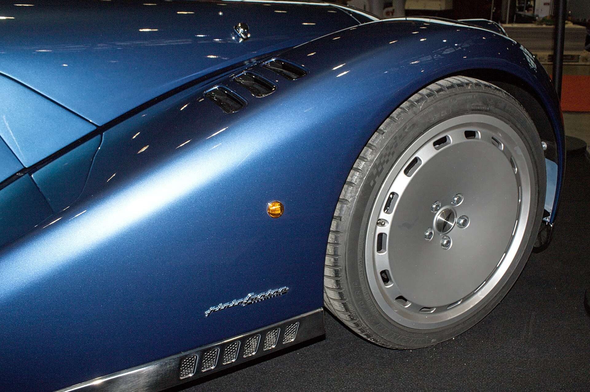 Blue Morgan Midsummer front wing with Pininfarina script, side vents and lightweight wheel
