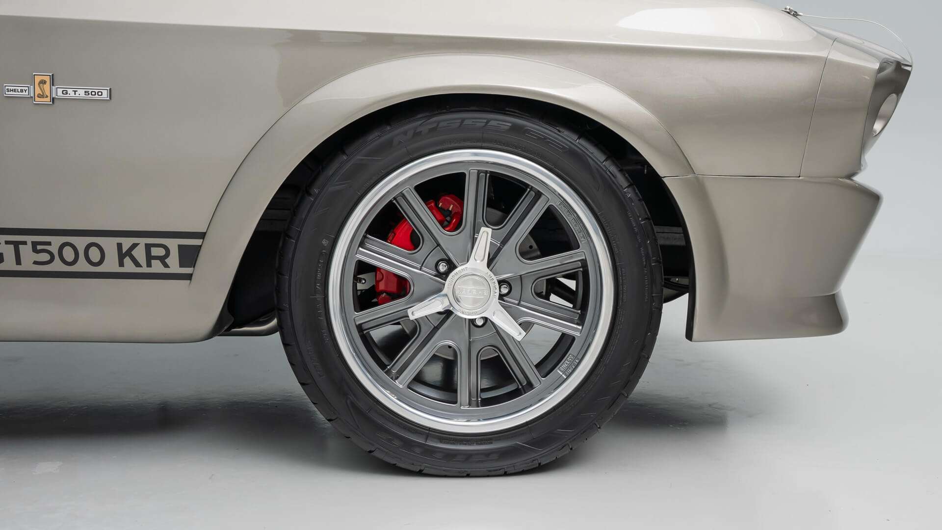 Shelby American Racing wheel with red brake caliper on the 1968 Mustang restomod