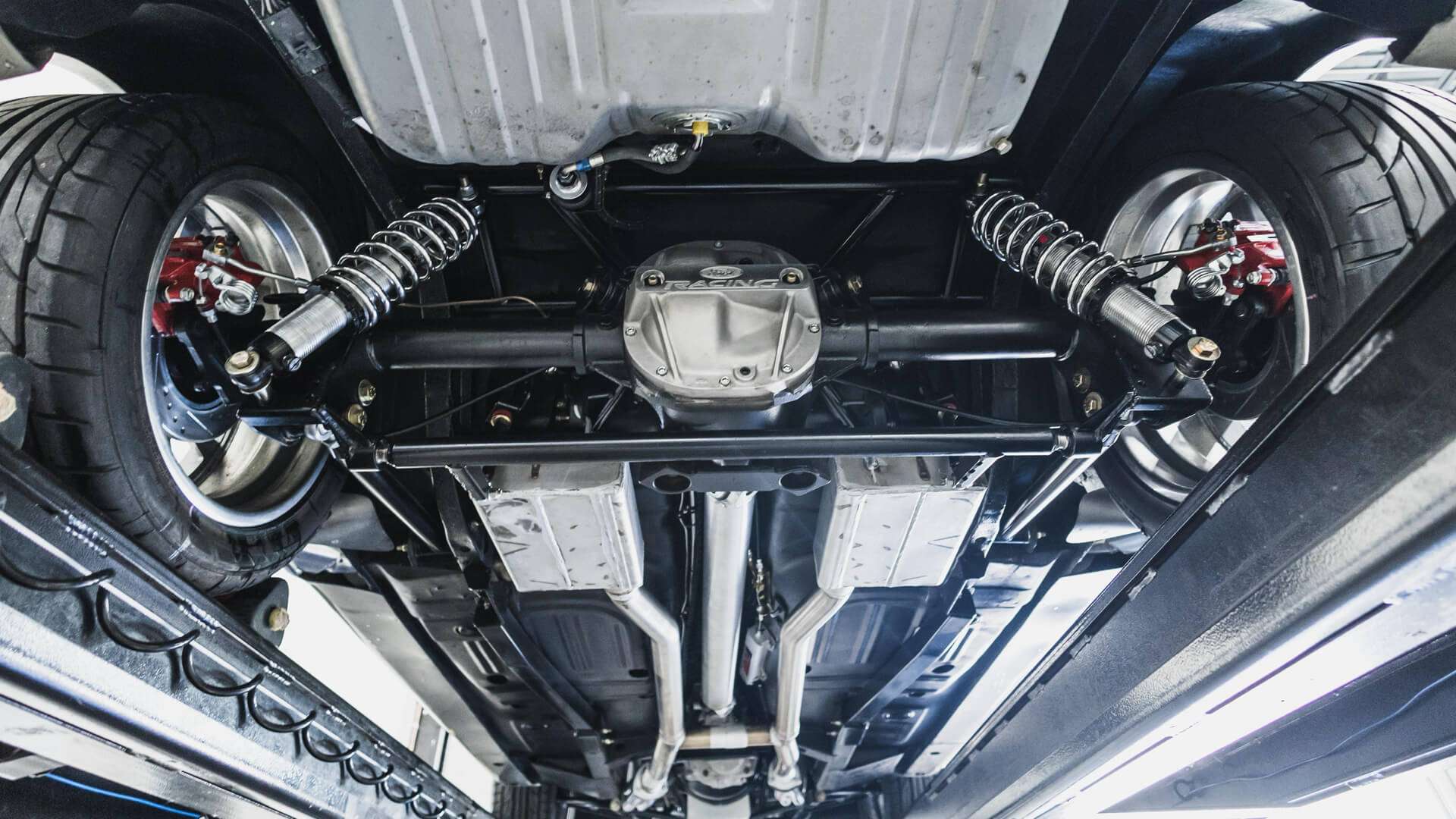 Underside view of the adjustable QA1 rear suspension and exhaust on the 1968 Mustang restomod