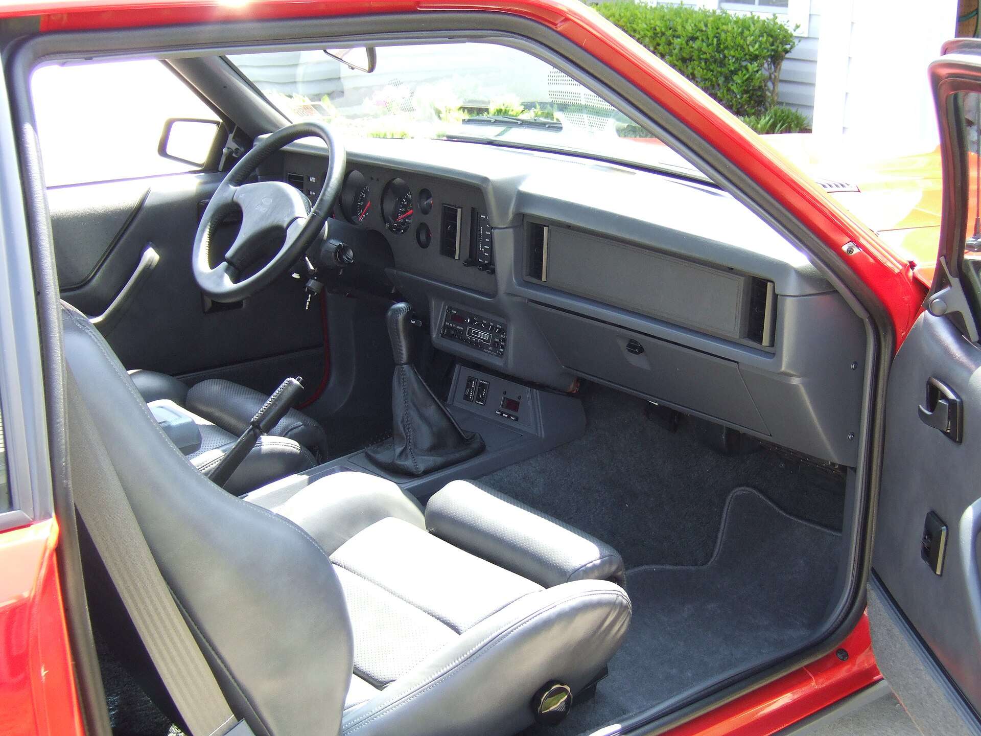 Gray leather sport bucket seats and dashboard inside a 1986 Ford Mustang SVO
