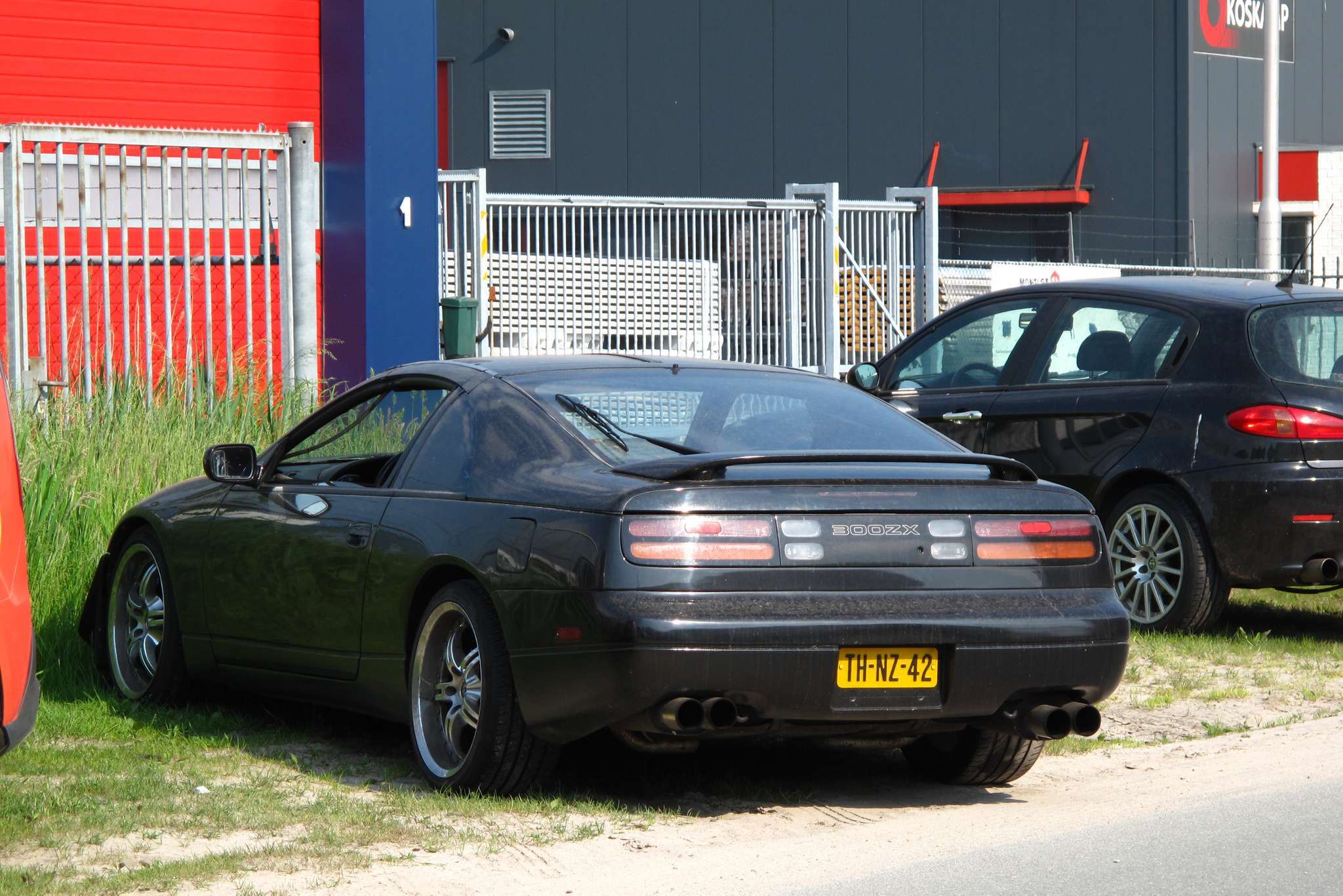 Black 1992 Nissan 300ZX Twin Turbo, a U.S.-market Z32, parked on grass in rear three-quarter view