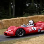 Red number 6 Penske Zerex Special sports-racing car at speed at the 2019 Goodwood Festival of Speed