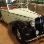 White 1947 Delahaye 135 MS Grand Luxe cabriolet by Henri Chapron with black fenders on display in the Prince of Monaco car collection