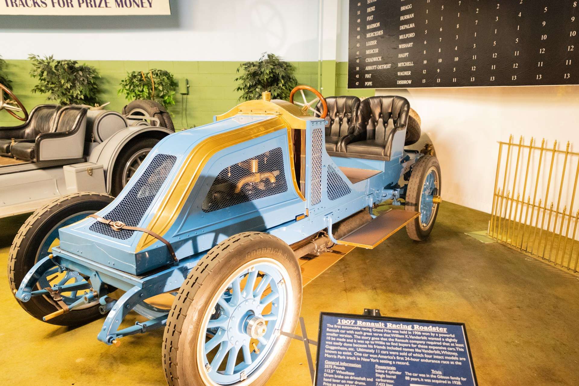Blue and yellow 1907 Renault 35-45 Vanderbilt Cup racer on display at the Simeone Foundation Automotive Museum