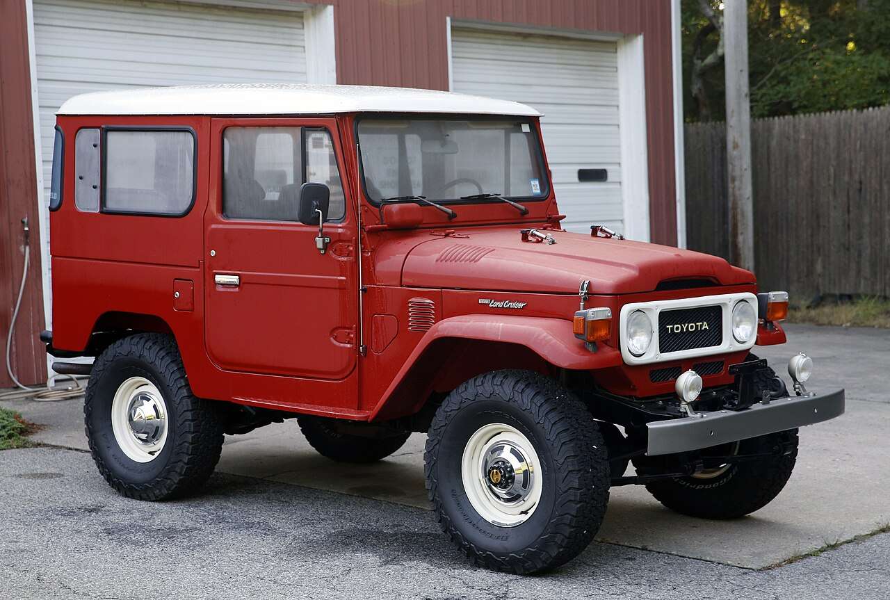 1982 Toyota Land Cruiser FJ40 in Freeborn Red with a white roof, restored with discreet upgrades