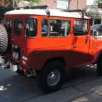 Restored 1977 Toyota FJ40 Land Cruiser short-wheelbase four-wheel-drive parked at a Minnesota car show