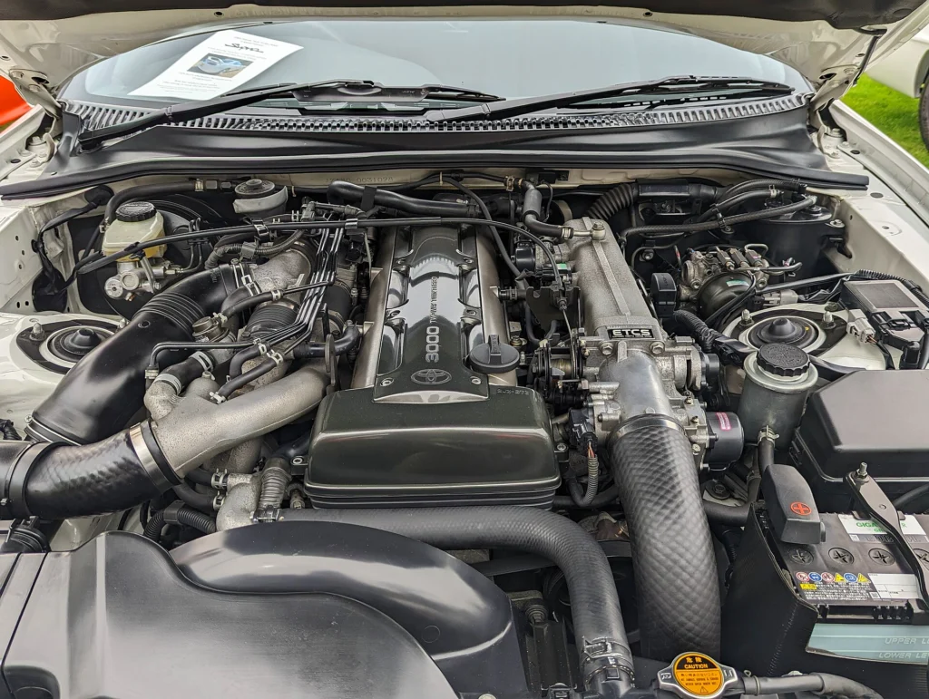 Engine bay of a 1995 Toyota Supra Mk IV Turbo showing the 2JZ-GTE twin-turbo inline-six