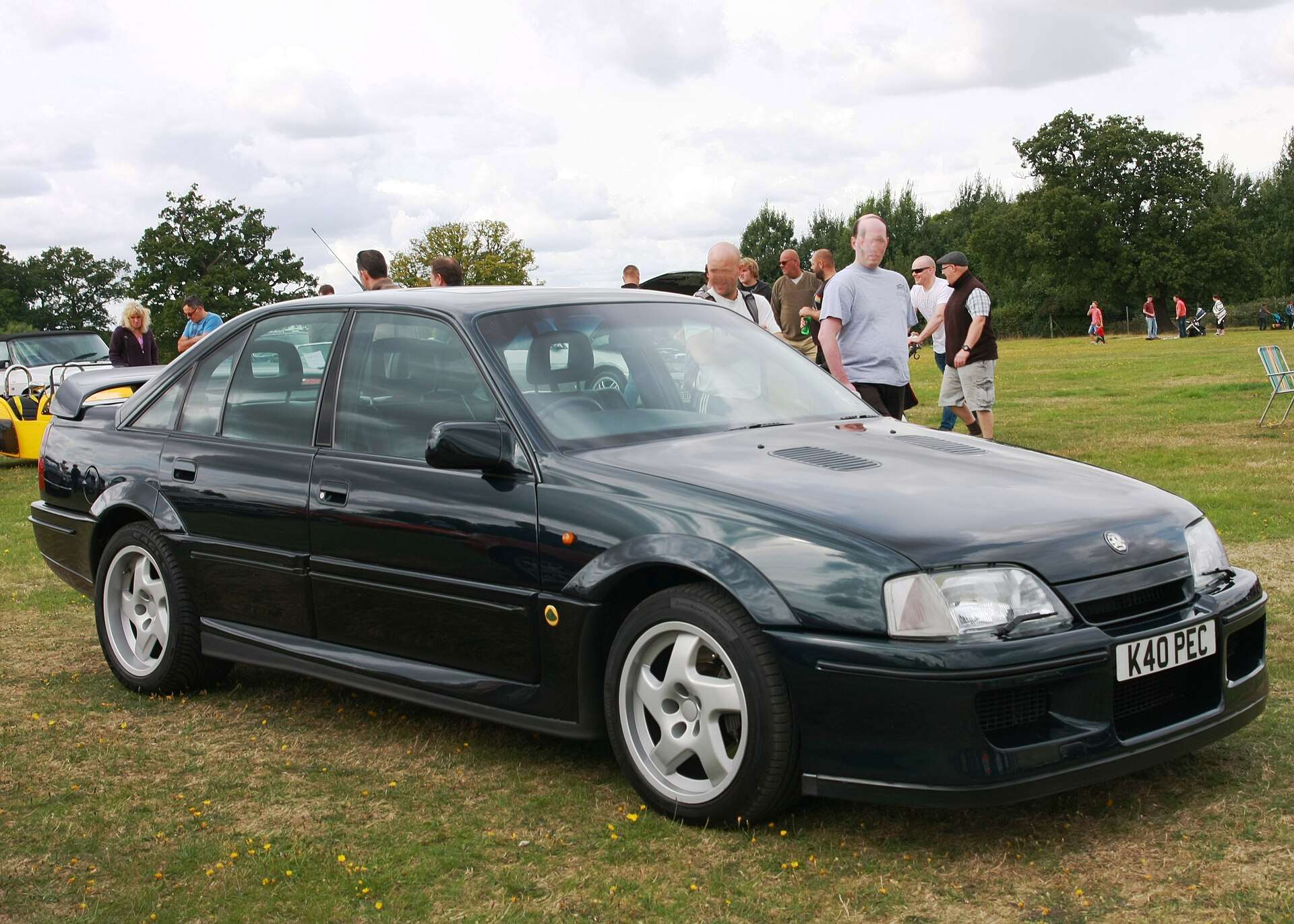 Green Vauxhall Lotus Carlton registered in 1993 parked on grass at a car show